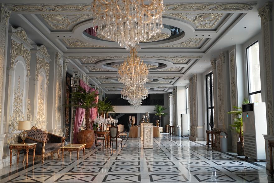 Casa Royal Event Complex entrance hall with marble floor and chandeliers