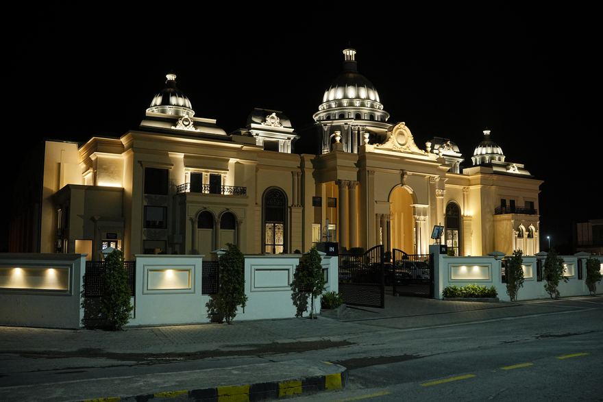 Casa Royal Event Complex lit up at night
