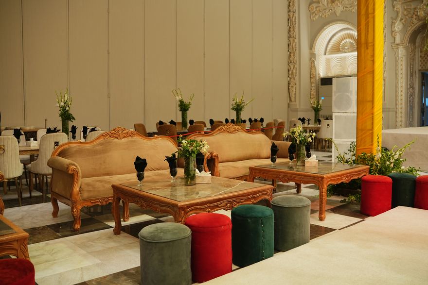 Seating area with velvet and gold furniture at Casa Royal