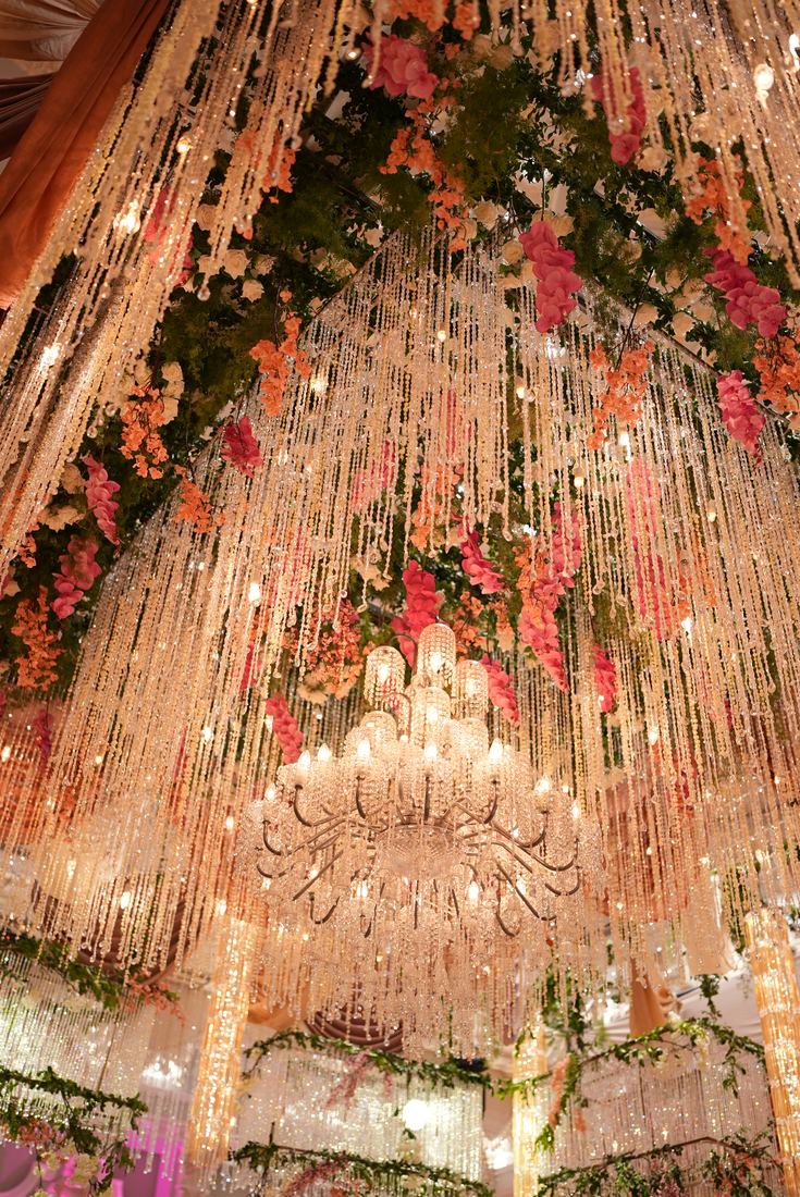 Flowers and hanging crystals above a dressed event hall at Casa Royal